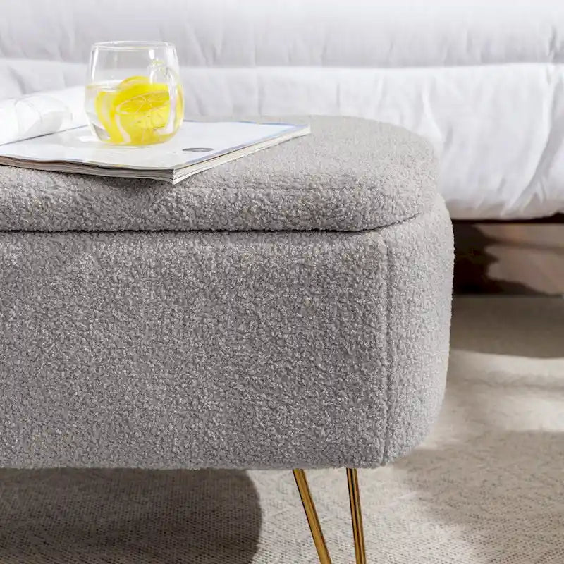 Banc de rangement en fausse fourrure grise avec pieds dorés